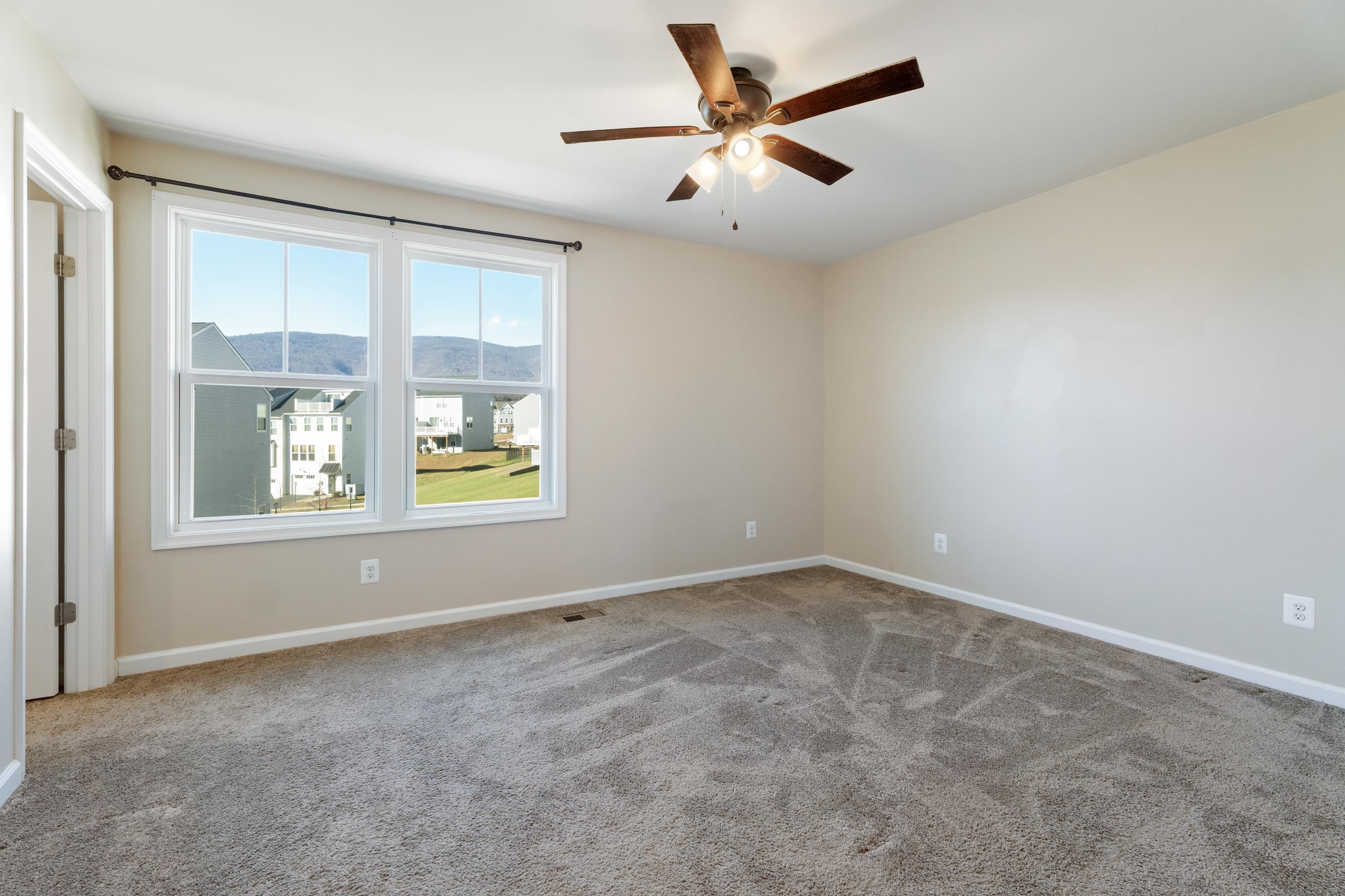 4416 Alston Street Crozet, VA 22932 - Photo 18 of 36 an empty room with windows and fan