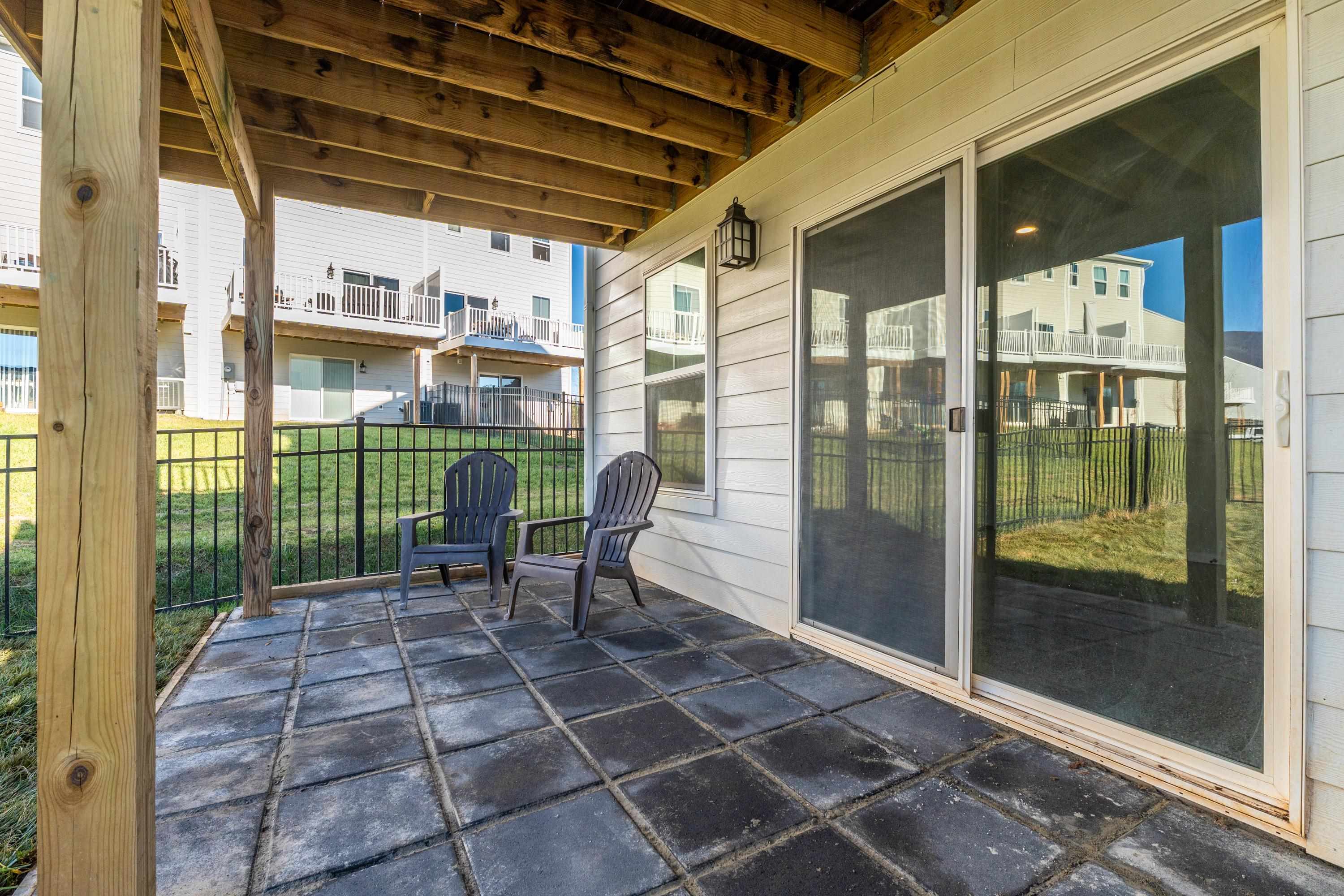 4416 Alston Street Crozet, VA 22932 - Photo 33 of 36 a view of a porch with a table and chairs