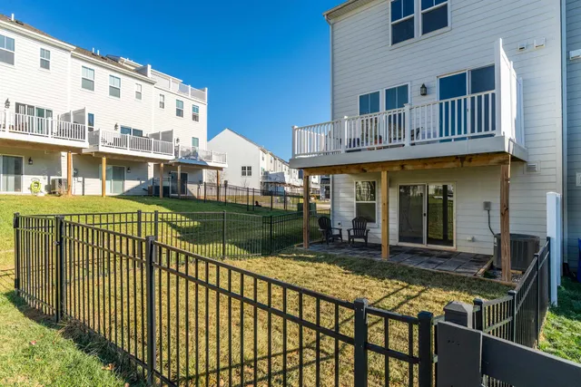 a view of a house with a wooden deck
