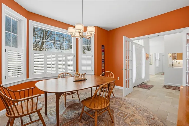 a dining room with furniture and window