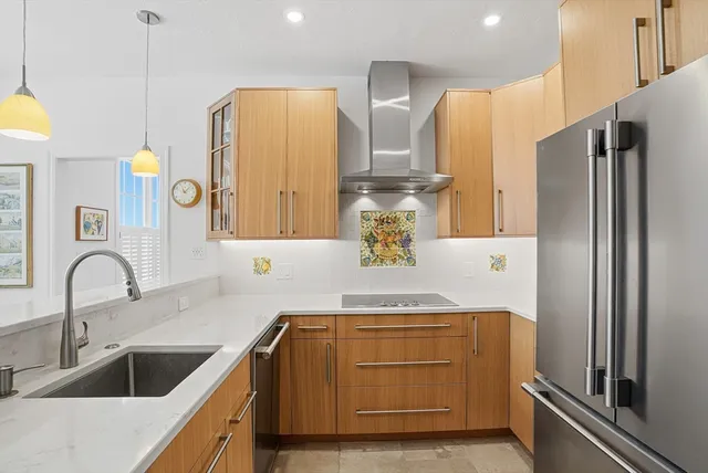 a kitchen with a sink and a refrigerator