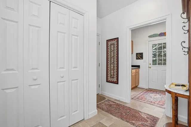 a view of an entryway with wooden floor