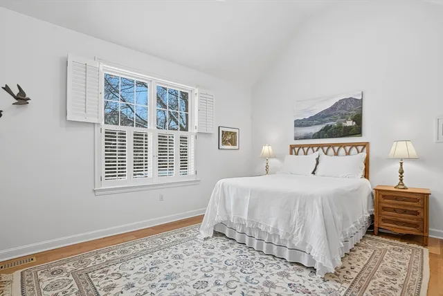 a bedroom with a bed and a television