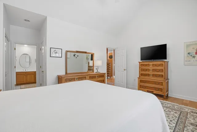 a bathroom with a double vanity sink mirror double and bathtub