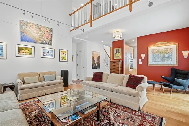 a living room with furniture or couch and a dining table