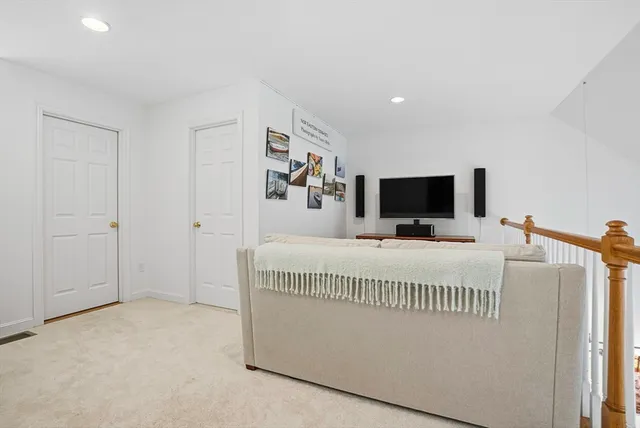 a view of a livingroom with furniture and a flat screen tv