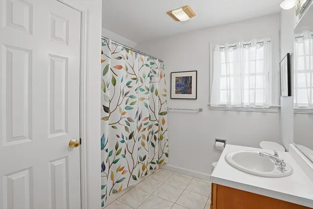 a view of a chairs and table in the back yard