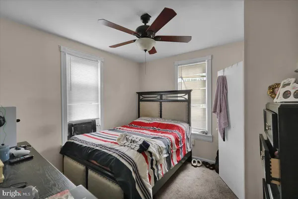 a bed room with furniture and a window