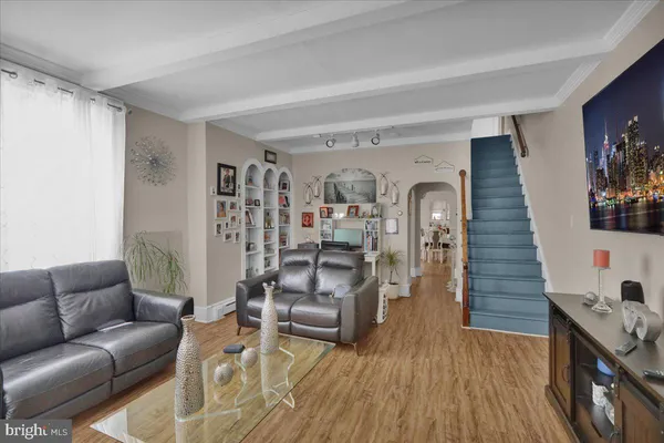 a view of room with cabinets and wooden floor