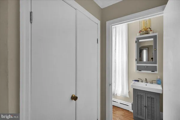 a kitchen with a refrigerator and a sink