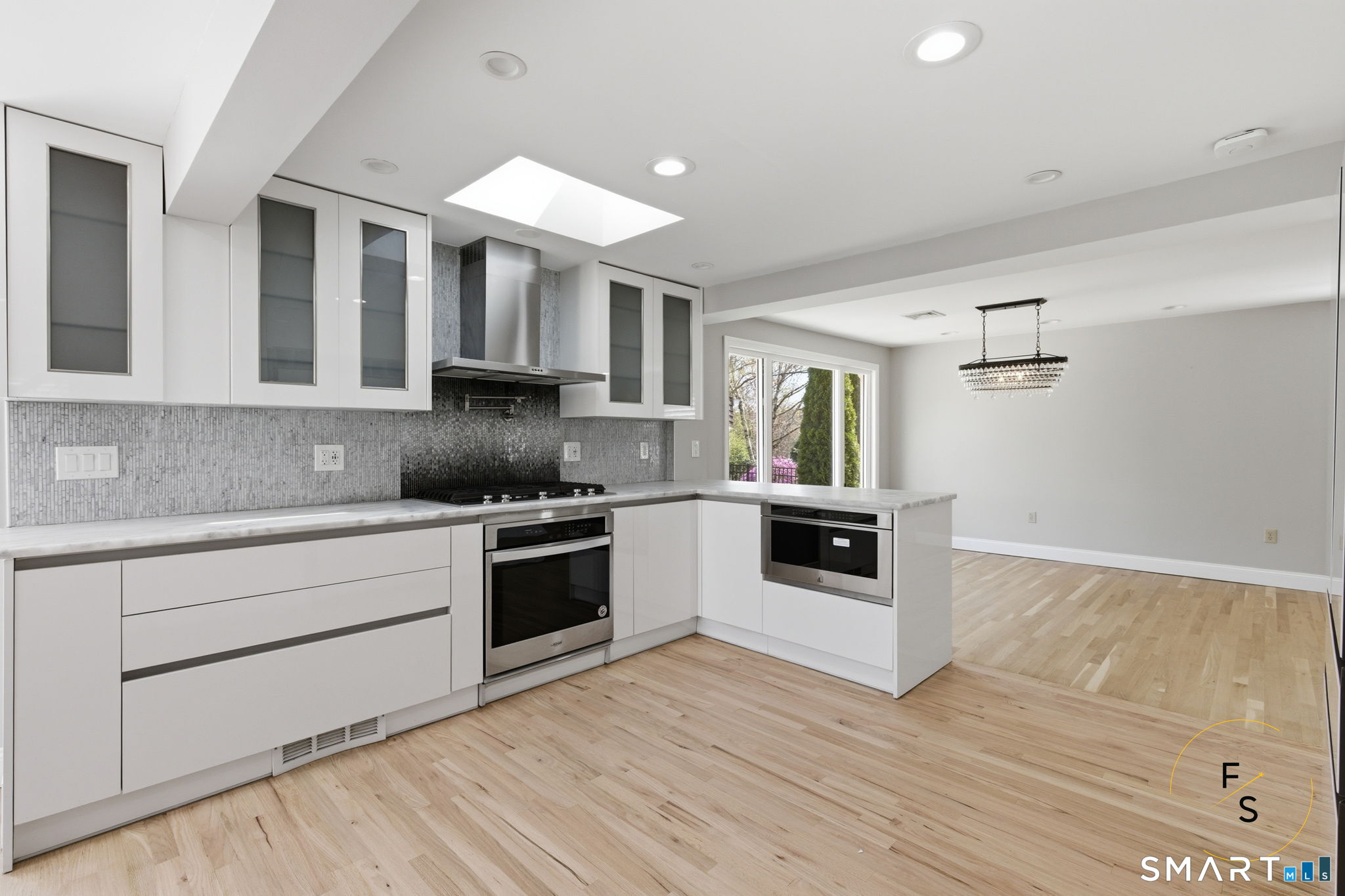 508 Highland Street Wethersfield, CT 06109 - Photo 12 of 40 a kitchen with a white stove top oven and sink