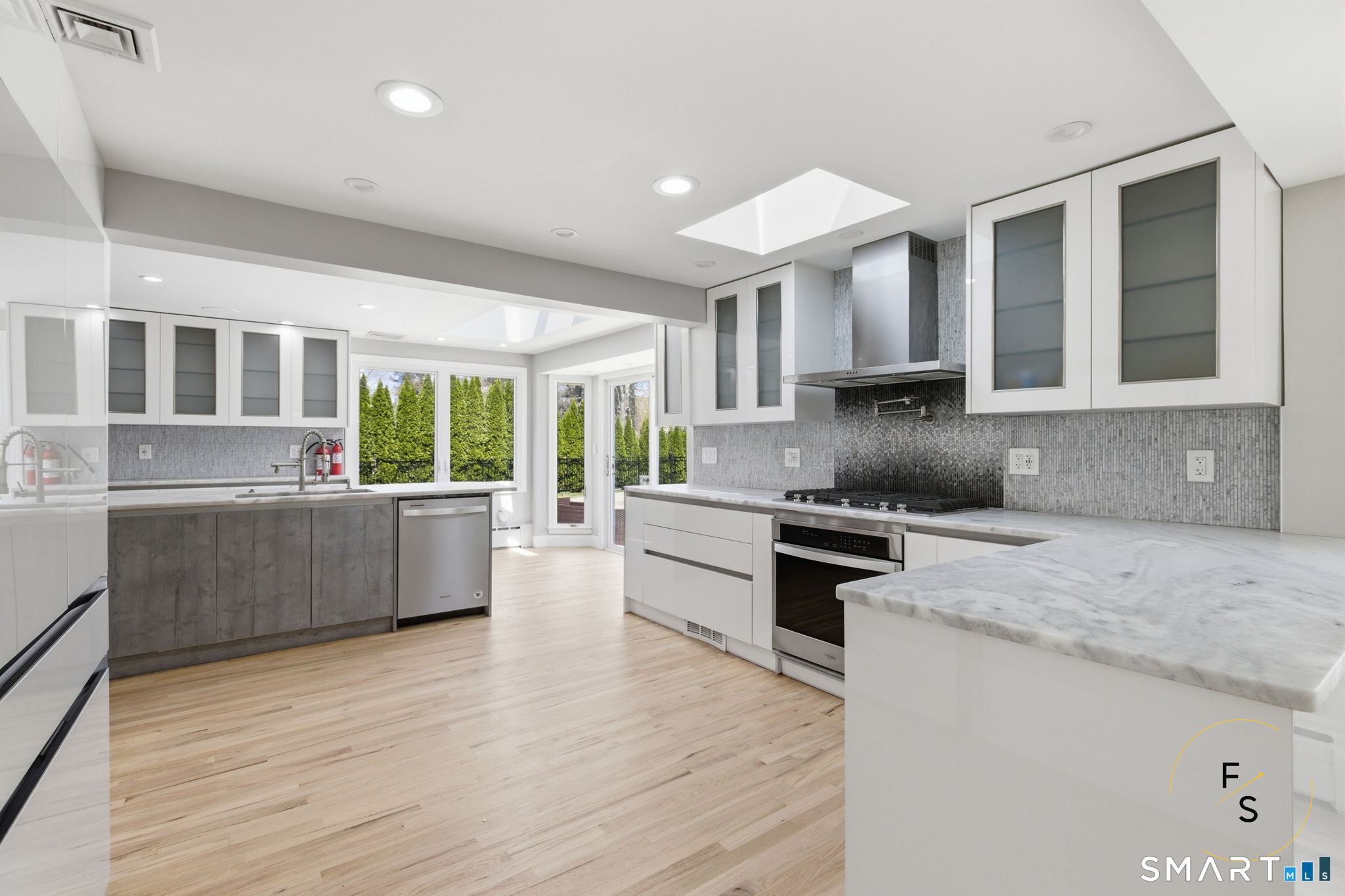 508 Highland Street Wethersfield, CT 06109 - Photo 13 of 40 a kitchen with stainless steel appliances granite countertop a stove a sink and a refrigerator