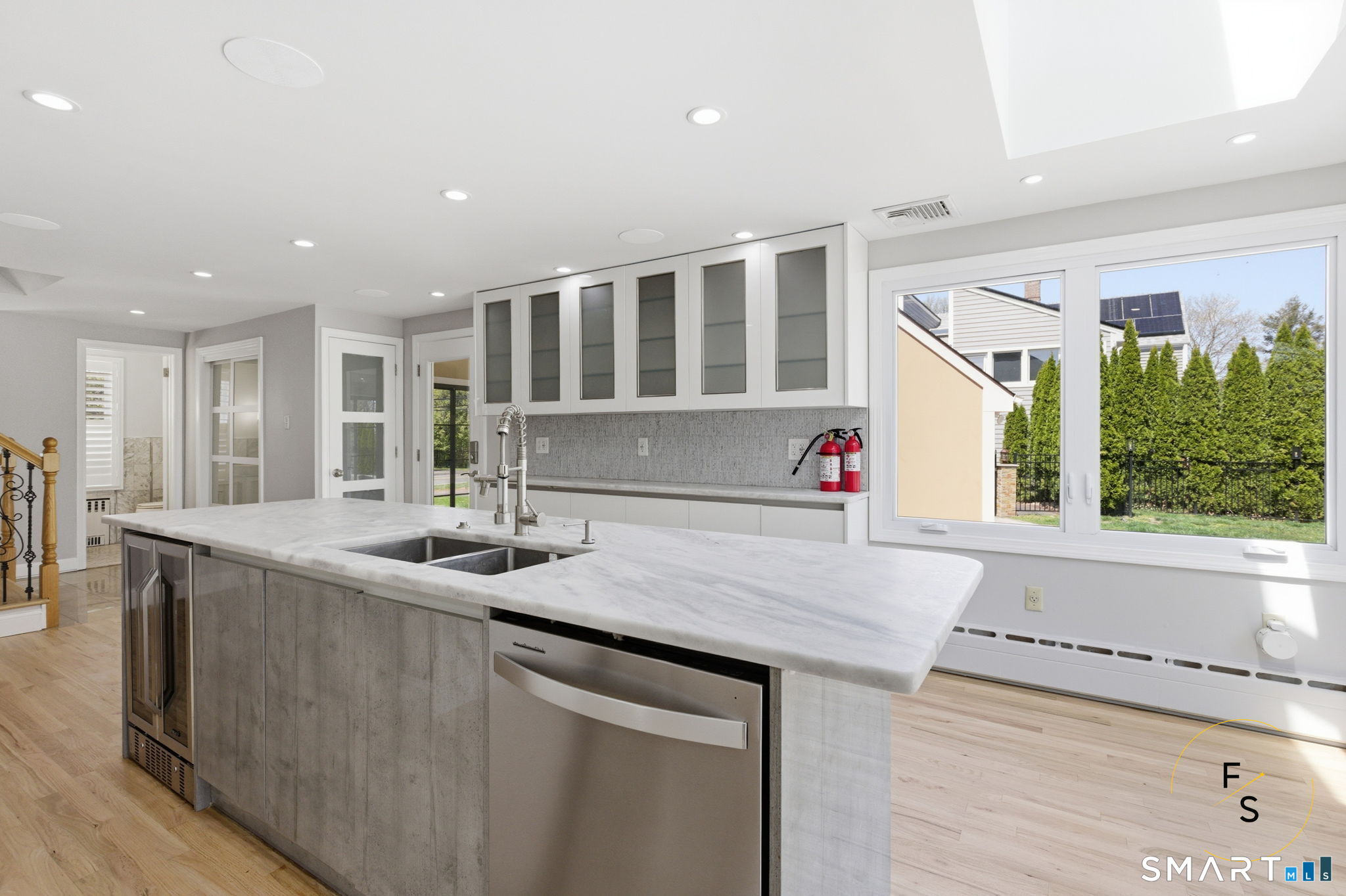 508 Highland Street Wethersfield, CT 06109 - Photo 14 of 40 a kitchen with stainless steel appliances granite countertop a sink and a large window