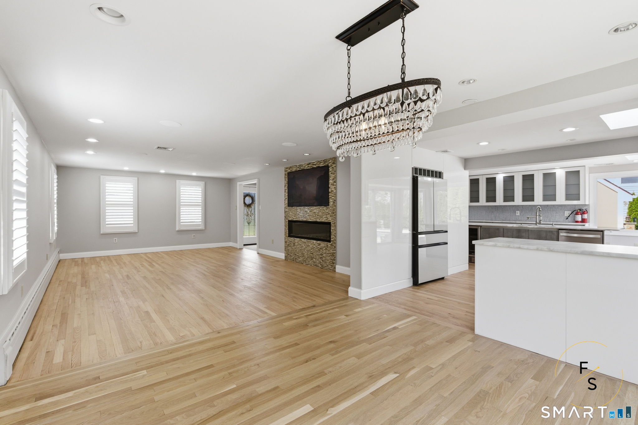 508 Highland Street Wethersfield, CT 06109 - Photo 16 of 40 a view of an empty room with kitchen and window