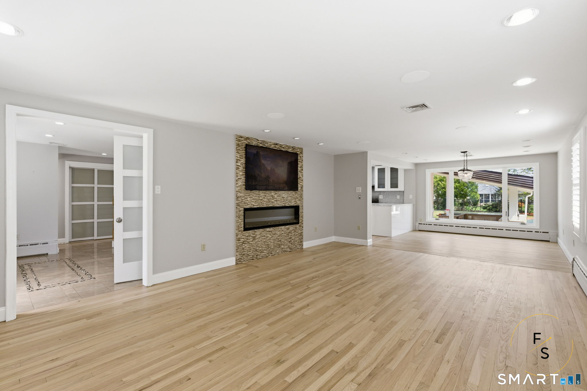 508 Highland Street Wethersfield, CT 06109 - Photo 17 of 40 an empty room with wooden floor and windows