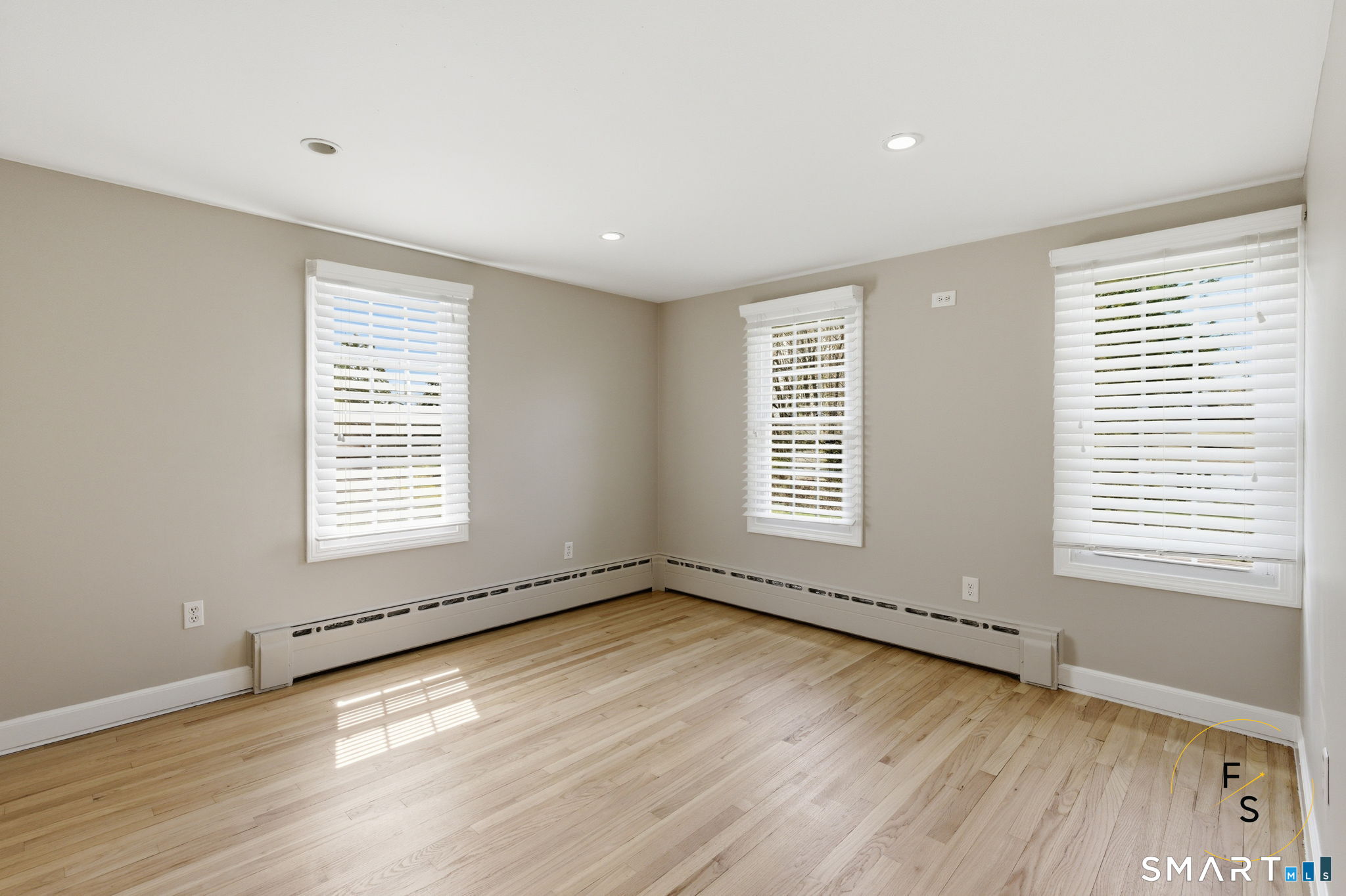 508 Highland Street Wethersfield, CT 06109 - Photo 28 of 40 an empty room with wooden floor and windows