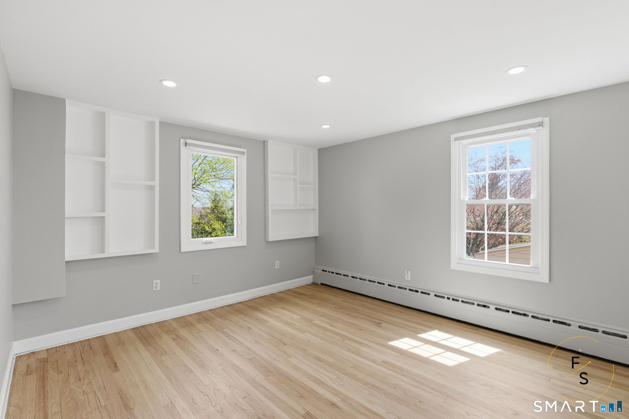 508 Highland Street Wethersfield, CT 06109 - Photo 30 of 40 an empty room with wooden floor and windows