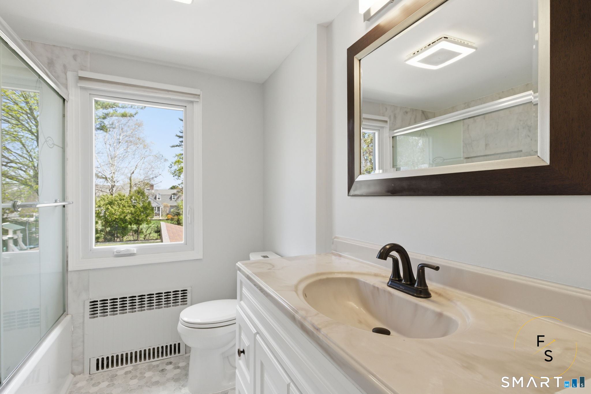 508 Highland Street Wethersfield, CT 06109 - Photo 32 of 40 a bathroom with a sink and a mirror