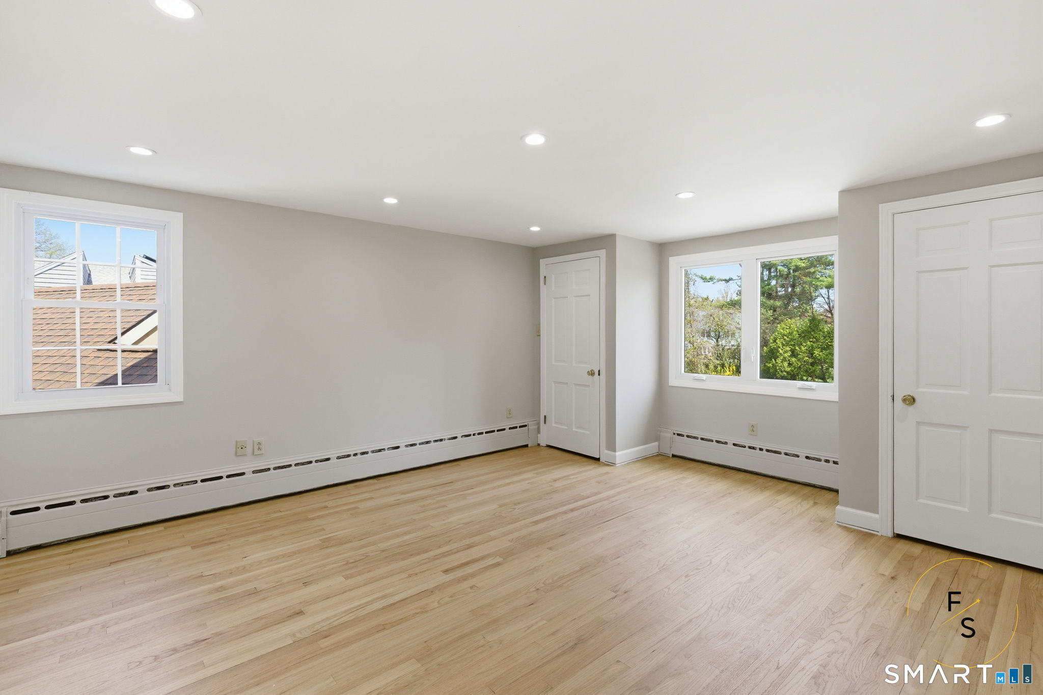 508 Highland Street Wethersfield, CT 06109 - Photo 33 of 40 an empty room with wooden floor and windows