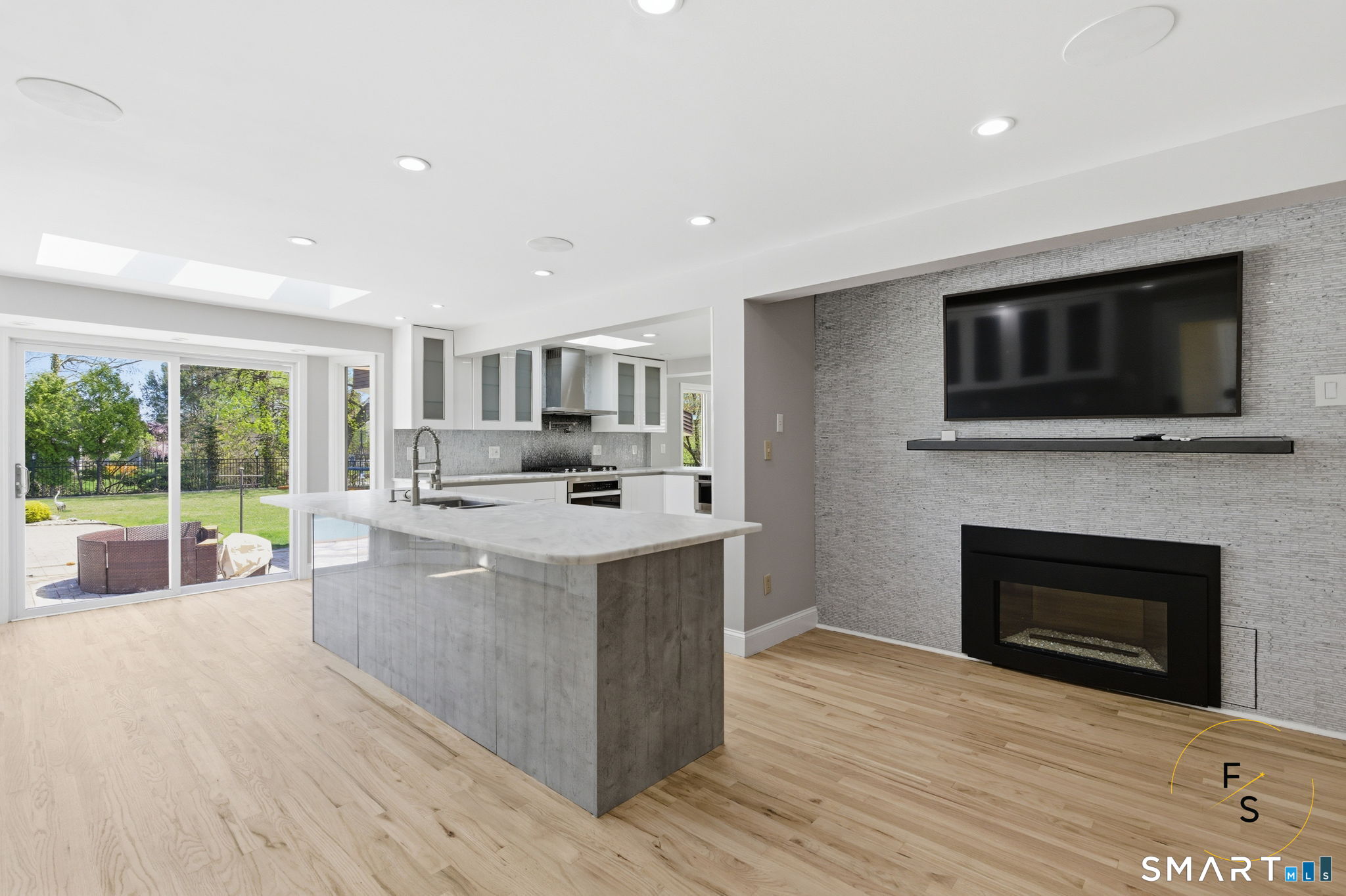 508 Highland Street Wethersfield, CT 06109 - Photo 9 of 40 a living room with furniture a fireplace and a flat screen tv