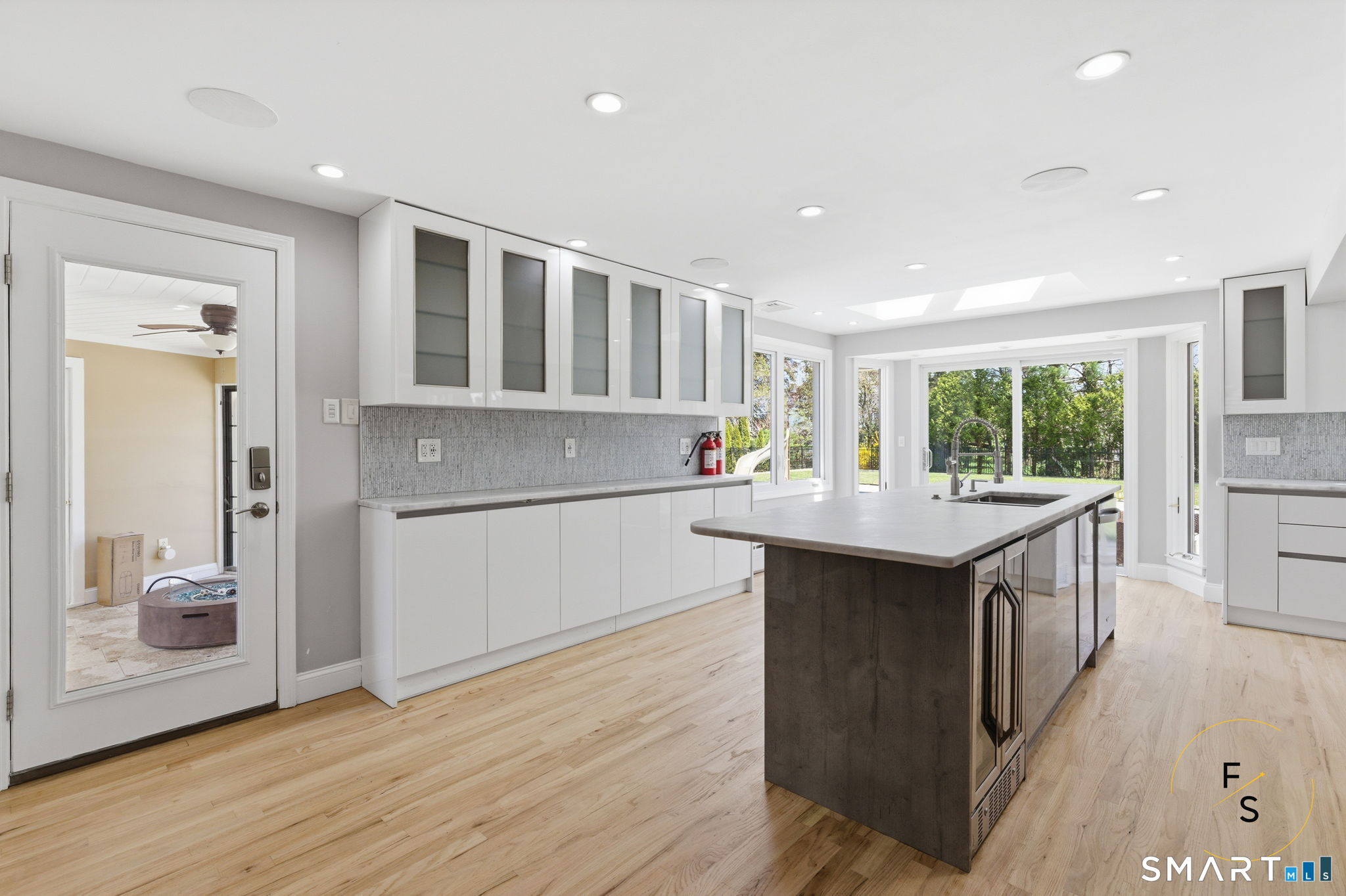 508 Highland Street Wethersfield, CT 06109 - Photo 10 of 40 a kitchen with kitchen island wooden floor and window