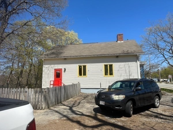 440 Central Avenue Seekonk, MA 02771 - Photo 4 of 11 a front view of a house with a yard