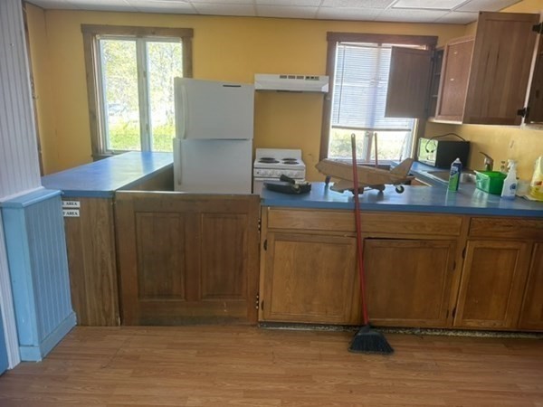 440 Central Avenue Seekonk, MA 02771 - Photo 5 of 11 a kitchen with stainless steel appliances granite countertop wooden cabinets a sink and a window
