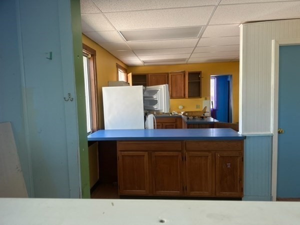 440 Central Avenue Seekonk, MA 02771 - Photo 10 of 11 a kitchen with a sink a counter space and wooden cabinets