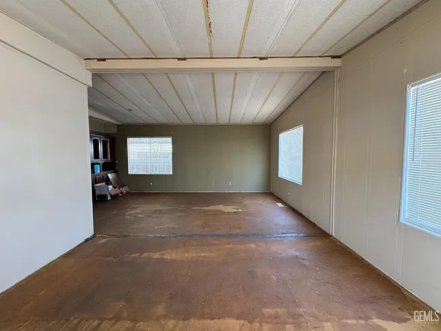 a view of an empty room with windows