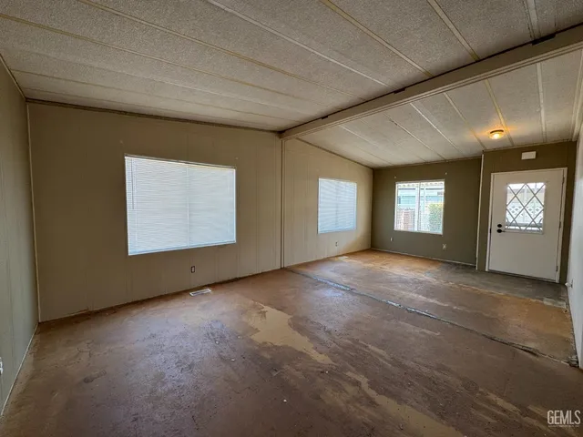 a kitchen with a stove a sink and a refrigerator