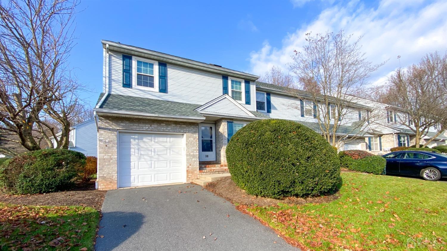 30 Snowflake Lane Edison, NJ 08820 - Photo 1 of 27 a front view of a house with a yard and garage