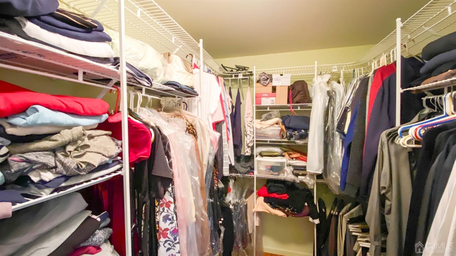 30 Snowflake Lane Edison, NJ 08820 - Photo 13 of 27 a view of walk in closet with clothes