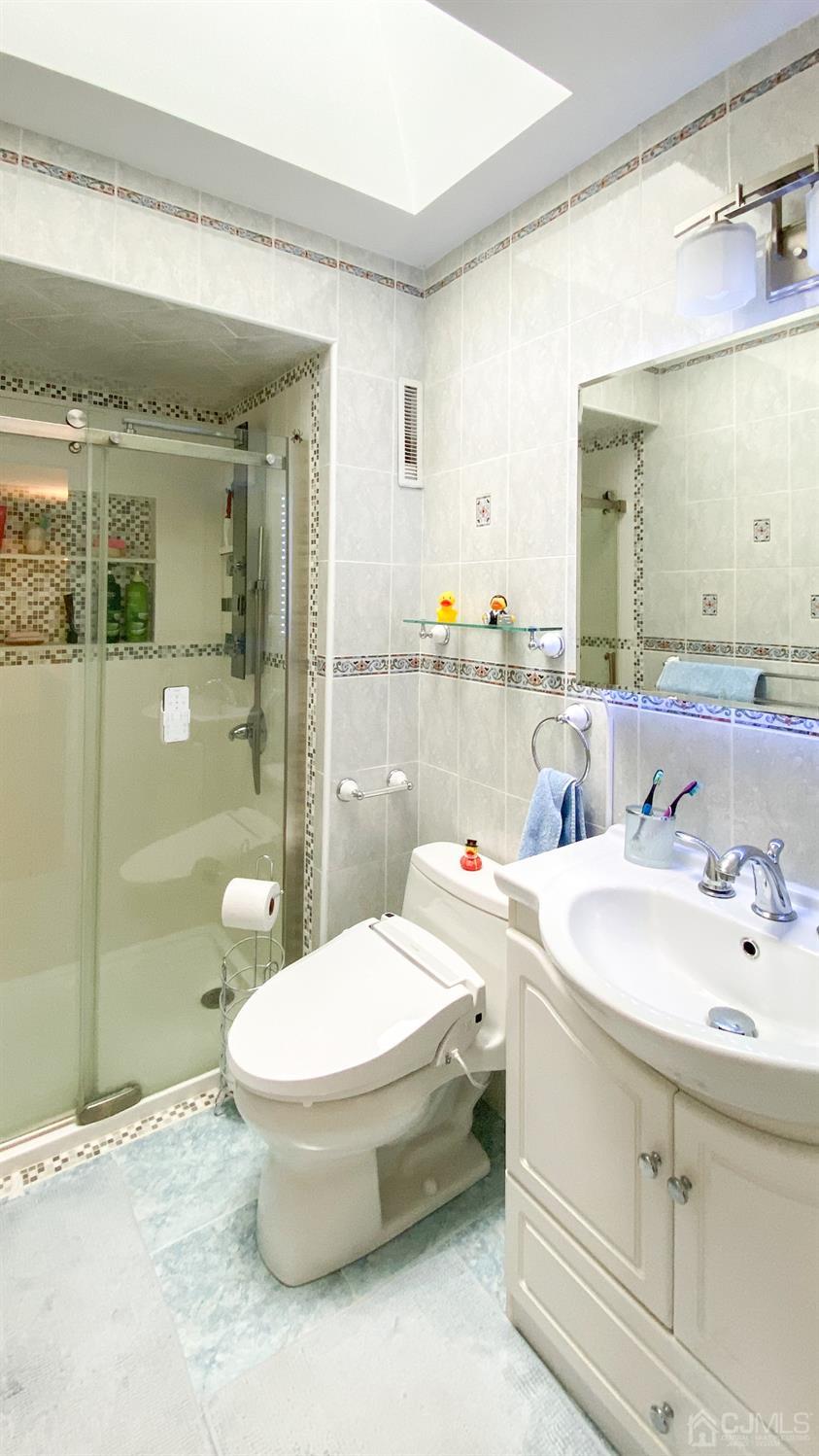 30 Snowflake Lane Edison, NJ 08820 - Photo 16 of 27 a bathroom with a sink toilet and shower