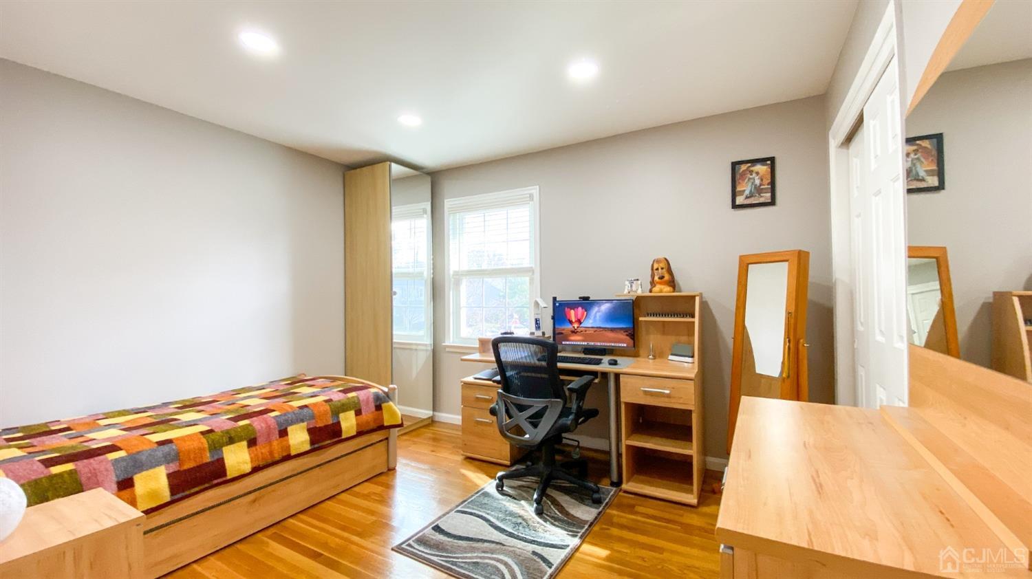 30 Snowflake Lane Edison, NJ 08820 - Photo 18 of 27 a bedroom with a bed and a desk in it