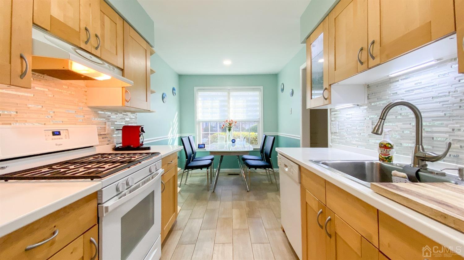 30 Snowflake Lane Edison, NJ 08820 - Photo 2 of 27 a kitchen with a sink a counter and appliances