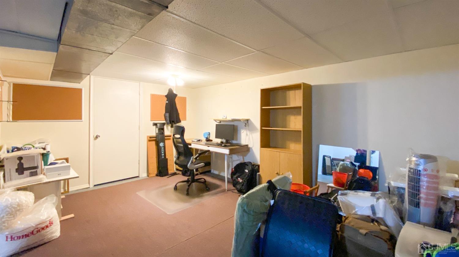 30 Snowflake Lane Edison, NJ 08820 - Photo 22 of 27 a view of a workspace with furniture and a living room