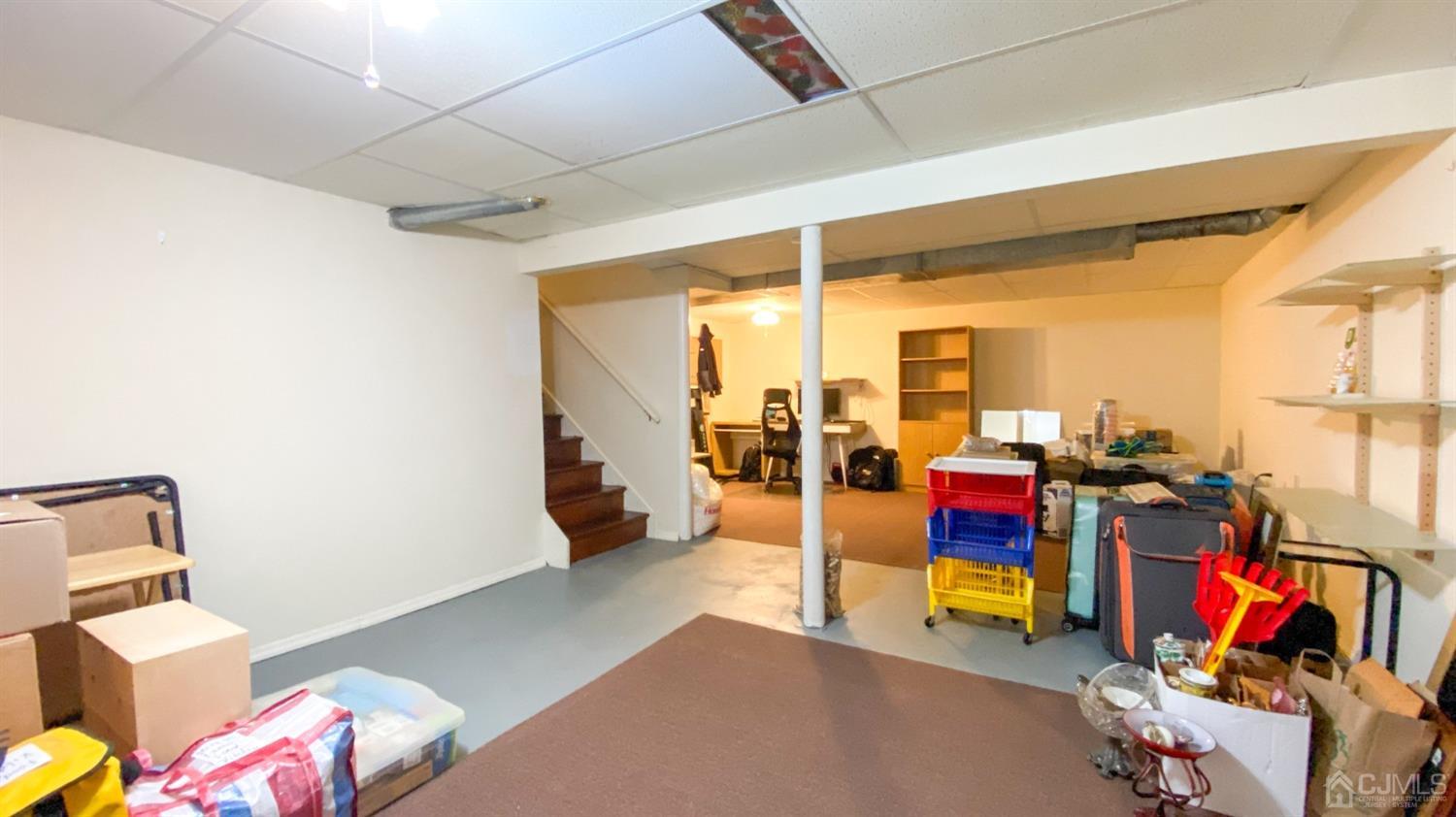 30 Snowflake Lane Edison, NJ 08820 - Photo 23 of 27 a bedroom with furniture and a gym machine