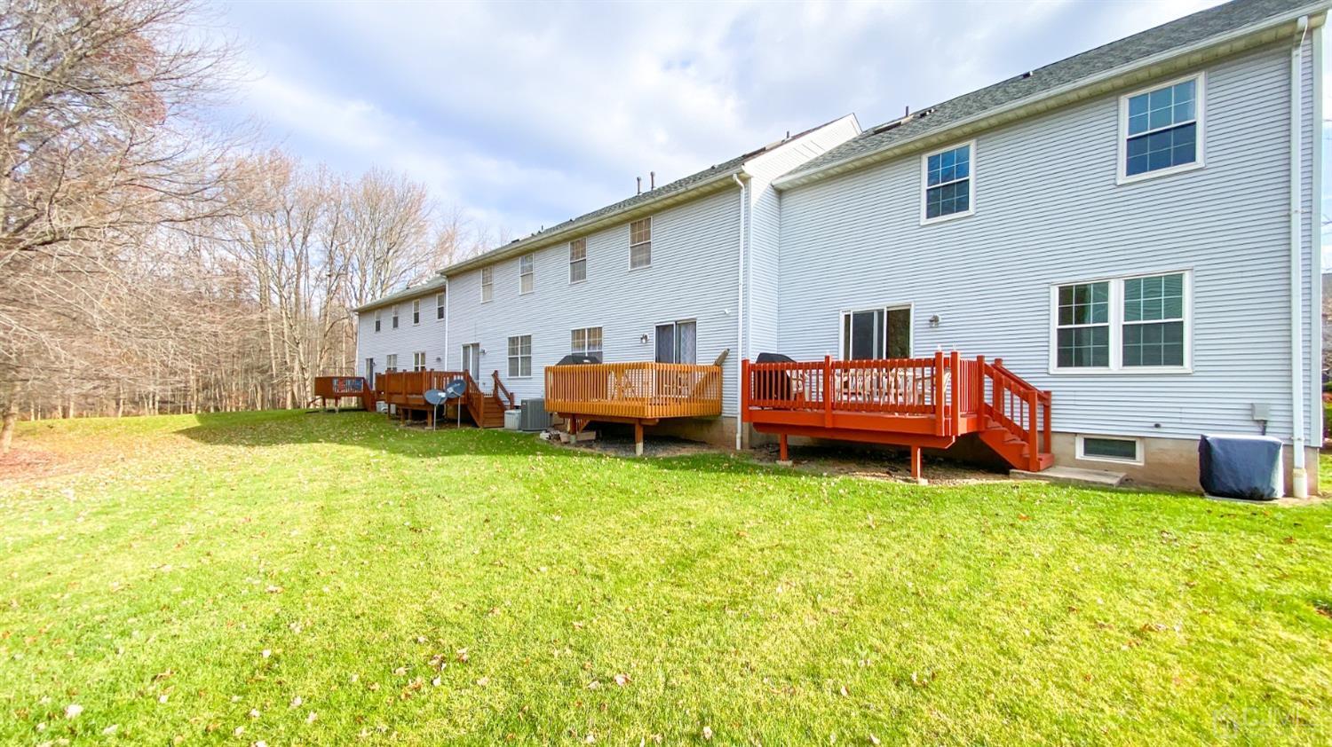 30 Snowflake Lane Edison, NJ 08820 - Photo 24 of 27 a backyard of a house with barbeque oven table and chairs