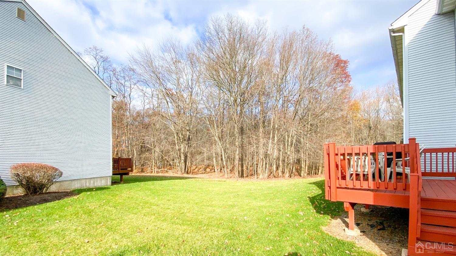 30 Snowflake Lane Edison, NJ 08820 - Photo 25 of 27 a backyard of a house with table and chairs