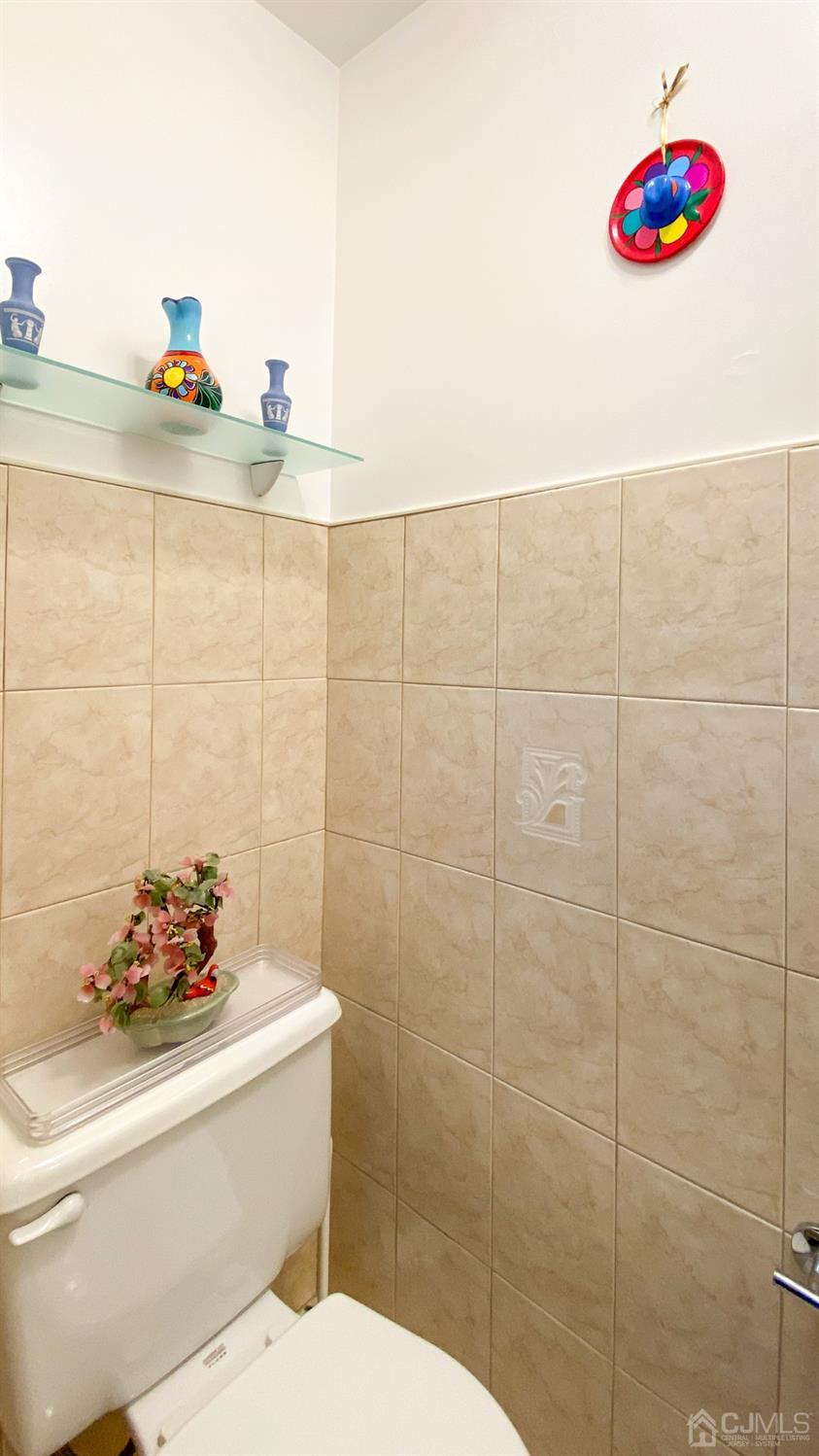 30 Snowflake Lane Edison, NJ 08820 - Photo 8 of 27 a bathroom with a sink and a mirror