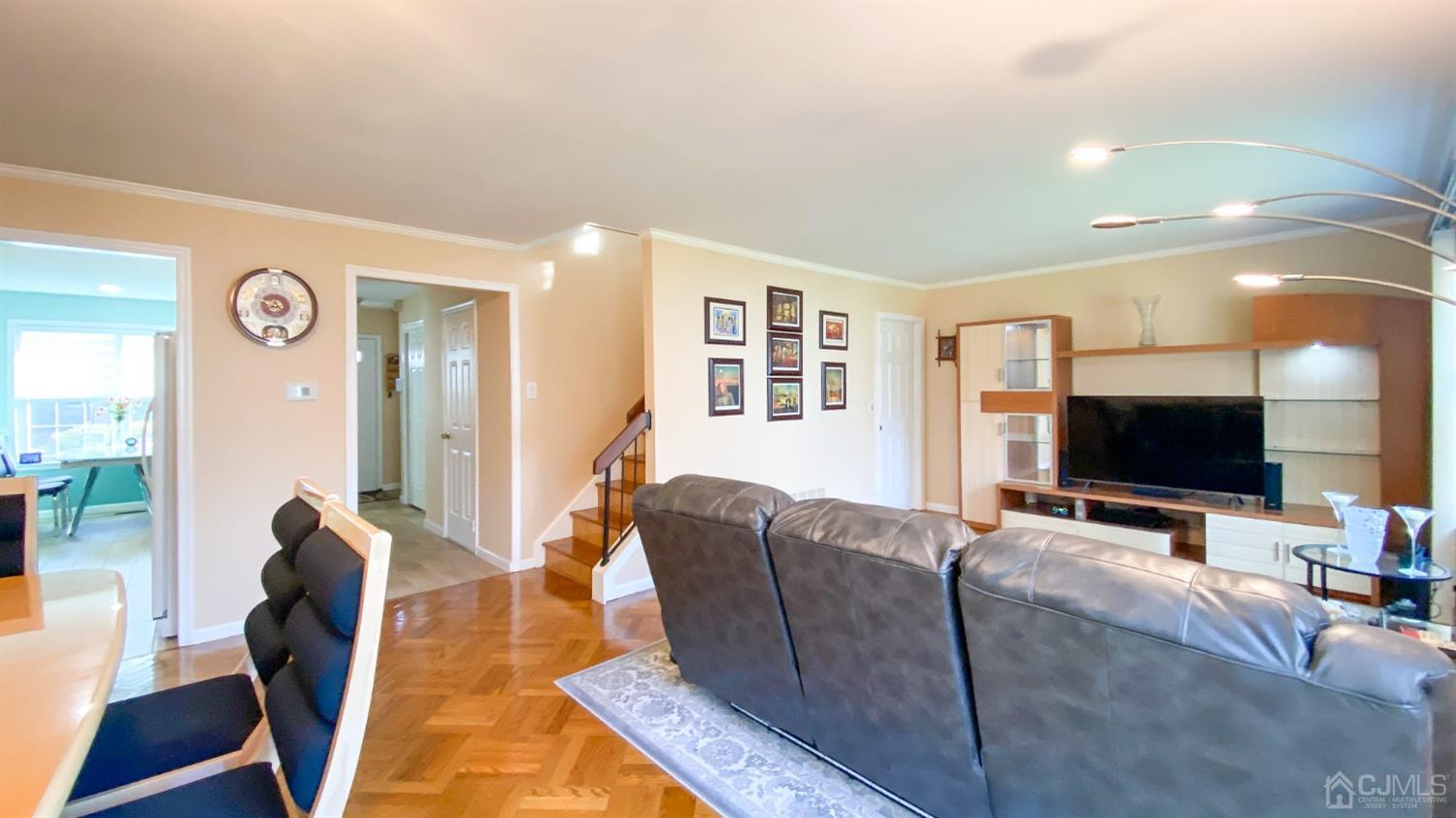 30 Snowflake Lane Edison, NJ 08820 - Photo 9 of 27 a living room with furniture and a flat screen tv