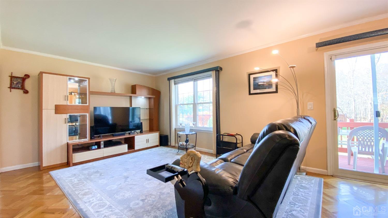 30 Snowflake Lane Edison, NJ 08820 - Photo 10 of 27 a living room with furniture and a flat screen tv
