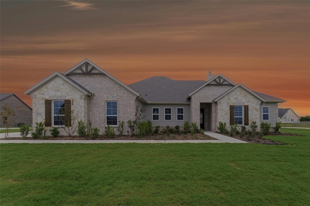 2204 Continent Court Krum, TX 76249 - Photo 1 of 28 Single-story residence featuring a mixed-material facade with stone and brick accents