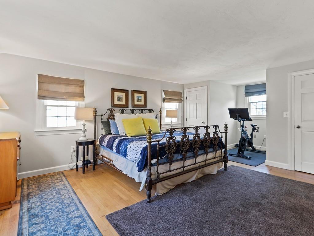 31 Emerson Place Needham, MA 02492 - Photo 23 of 27 a spacious bedroom with a bed and window