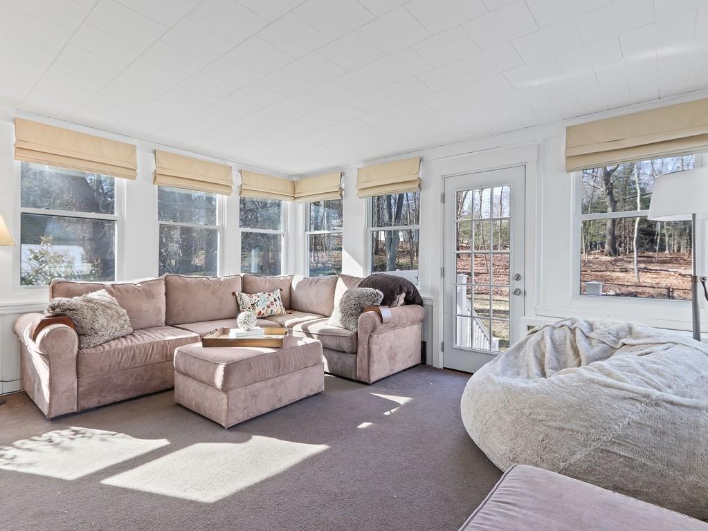 31 Emerson Place Needham, MA 02492 - Photo 7 of 27 a living room with furniture and large windows