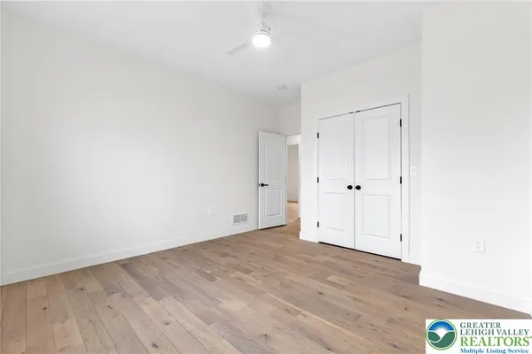 an empty room with wooden floor