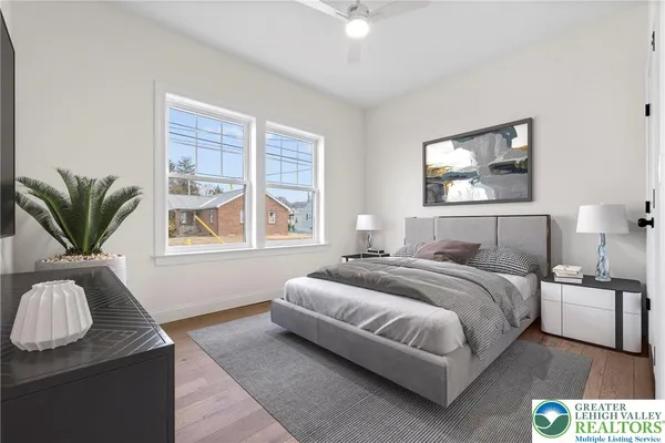 a bedroom with bed and a window