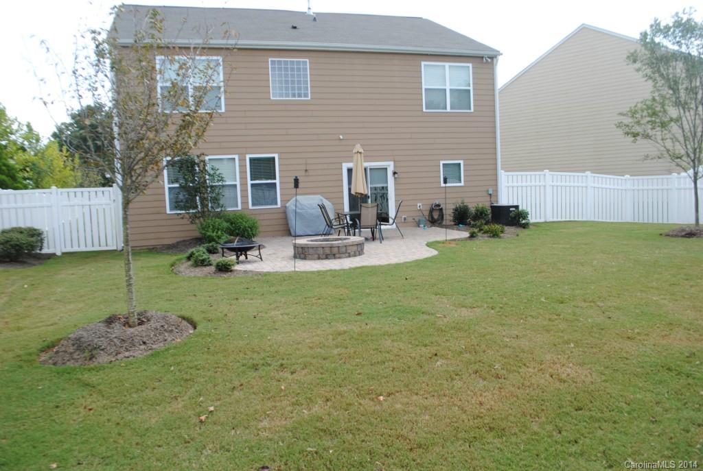 2604 Aldergrove Road Matthews, NC 28105 - Photo 14 of 16 a backyard of a house with seating space