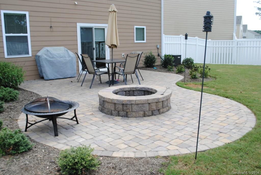 2604 Aldergrove Road Matthews, NC 28105 - Photo 15 of 16 a view of a patio with table and chairs and potted plants