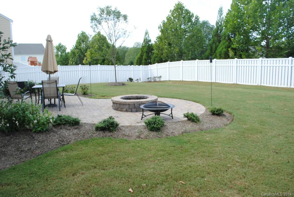 2604 Aldergrove Road Matthews, NC 28105 - Photo 16 of 16 a view of backyard with table and chairs